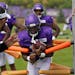 Vikings running back Dalvin Cook (33) carried the ball as he ran drills during training camp Wednesday.
