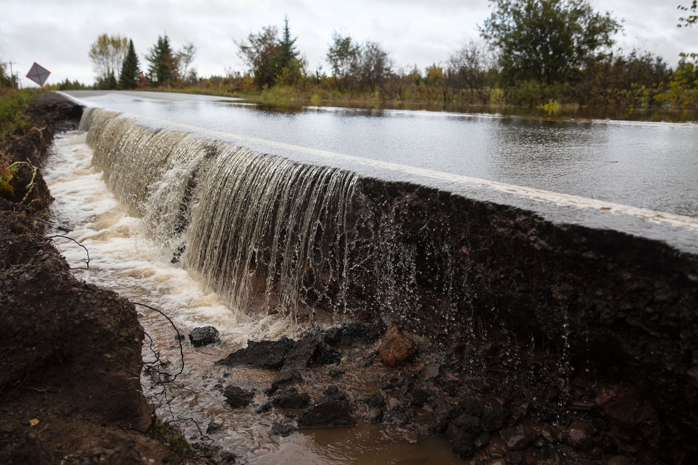 A section of County Highway K in South Range, WI was washed out and eventually closed off on Monday morning due to heavy rain that started Sunday night. ]
ALEX KORMANN &#x2022; alex.kormann@startribune.com Northwestern Wisconsin saw some severe flash flooding Monday morning that washed out and damaged several roads, forcing authorities tossup down parts of County Highway K.