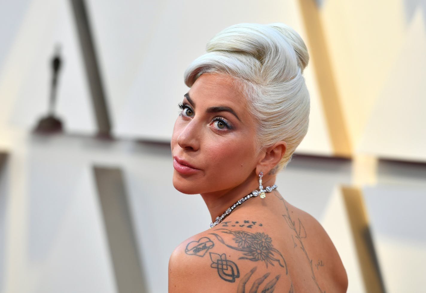 FILE - In this Feb. 24, 2019 file photo, Lady Gaga arrives at the Oscars at the Dolby Theatre in Los Angeles. Billionaire investor William Ackman is setting his sights on the music industry, as his blank check company confirms it is in talks to buy a 10% stake of Universal Music Group for about $4 billion. French media company Vivendi, which owns Universal Music, also confirmed the discussions on Friday, June 4, 2021. (Photo by Jordan Strauss/Invision/AP, File)