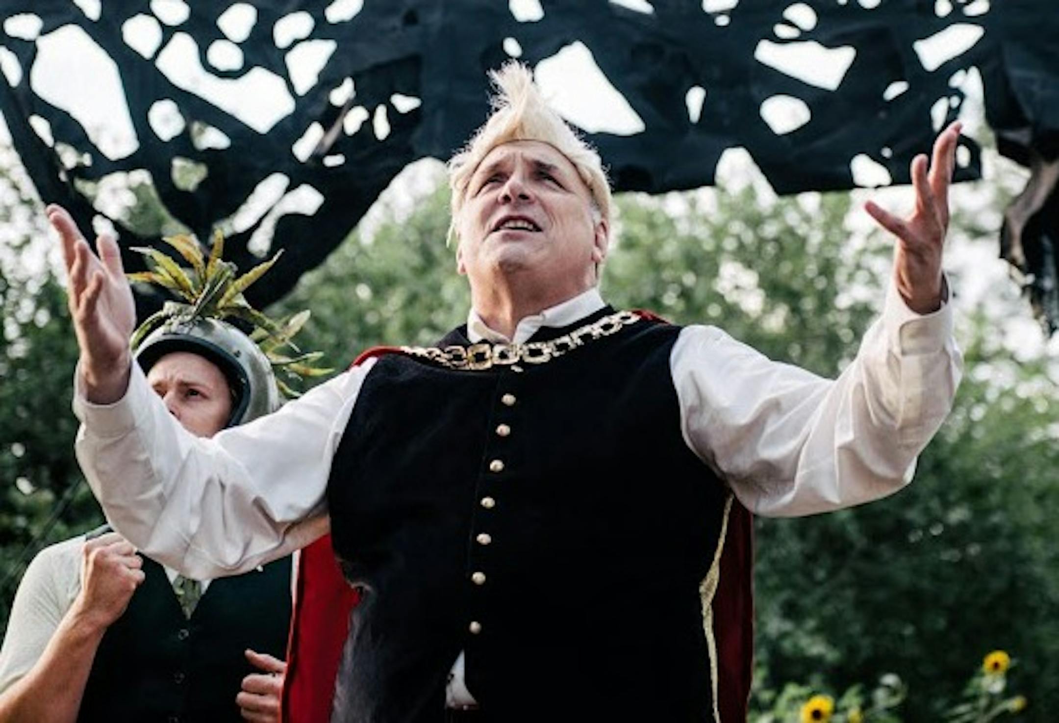 Photo credit: Marie Ketring: Pictured from left to right: Michael Wolfe, Peter Middlecamp, Jim Ahrens, Maggie Lofboom. King Arthur, played by Jim Ahrens, addresses the crowd about his big plans for Cameloteapolis in Mixed Precipitation's production of "King Arthur," a baroque opera. He's hoping to leave his legacy in the form of a giant new jousting stadium in this creative adaptation of the "semi-opera," featuring plenty of speaking parts, that was first performed in 1691.
