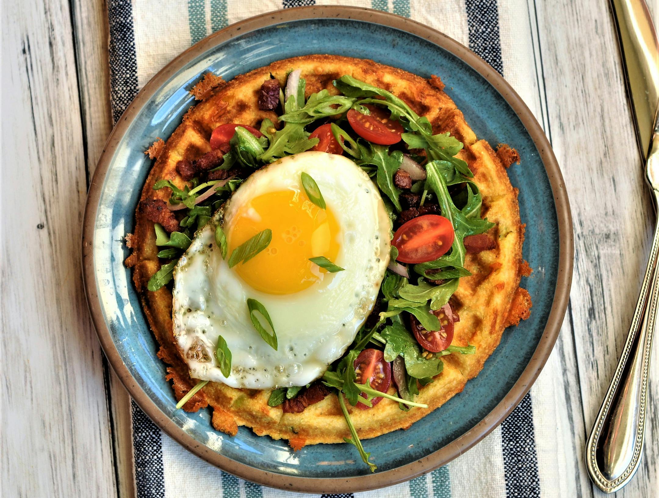 Corn and Cheddar Waffles With Bacon and Egg Arugula Salad.