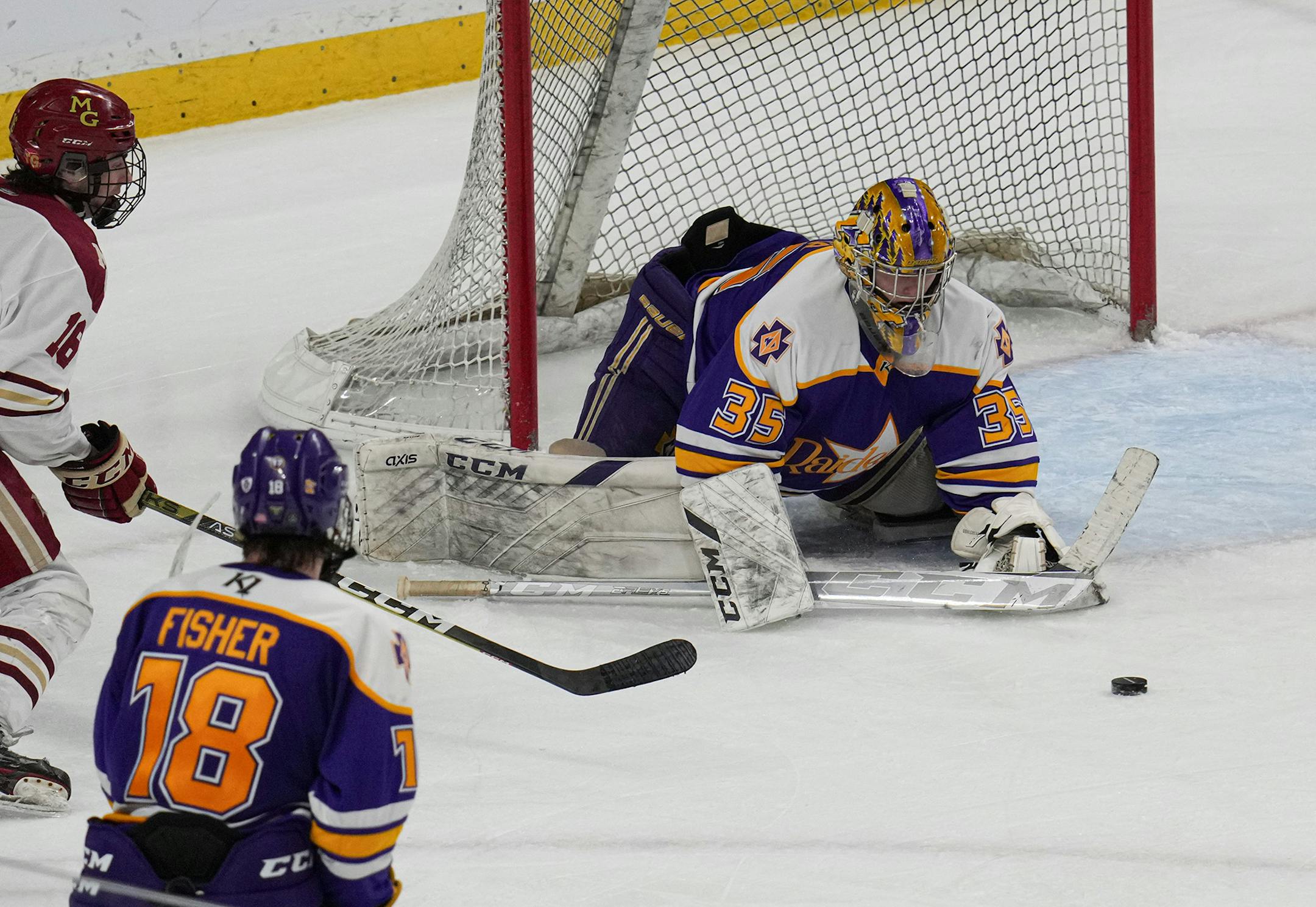 Cretin-Derham Hall goaltender Leo Miller (35) with a save in the third period.