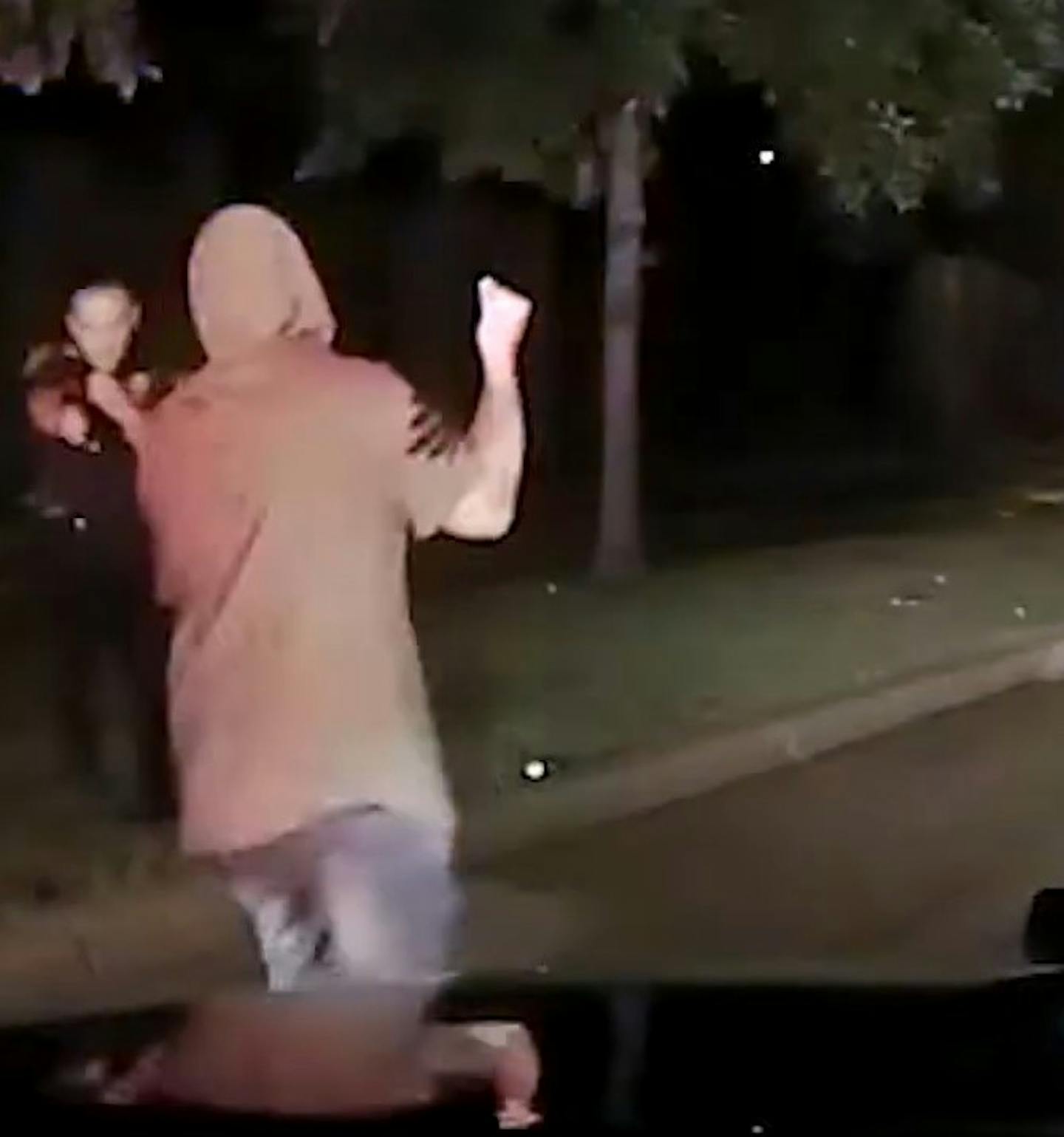 A still frame from Officer Nicholas Pedersen's squad car shows Brian Quinones-Rosario approaching the officer with a knife. Pedersen ordered Quinones-Rosario several times to drop the knife before firing.