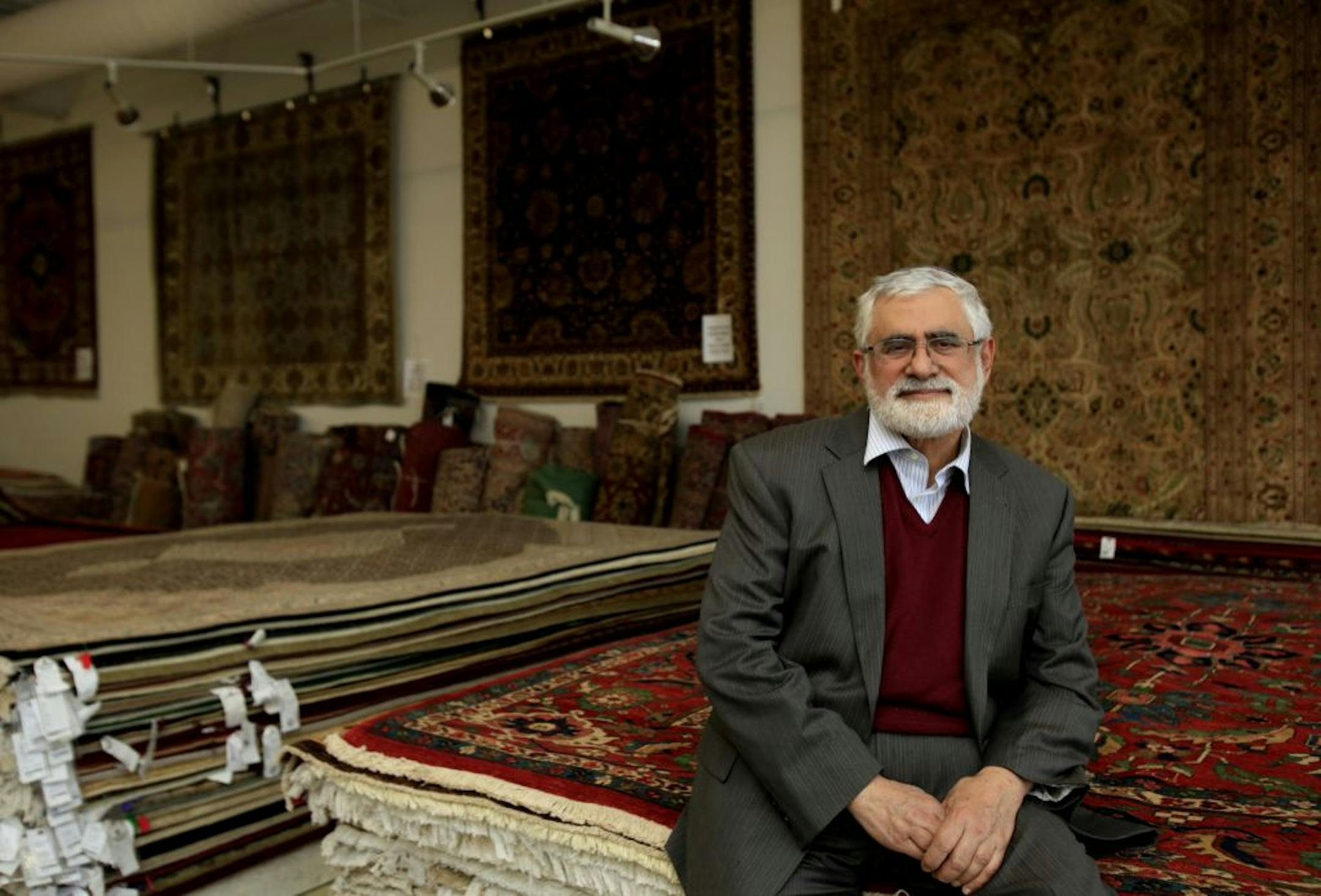 Kurosh Amrami of Grand Oriental Rugs in Edina is finding it difficult to liquidate his inventory of high-end, hand-knotted rugs.
