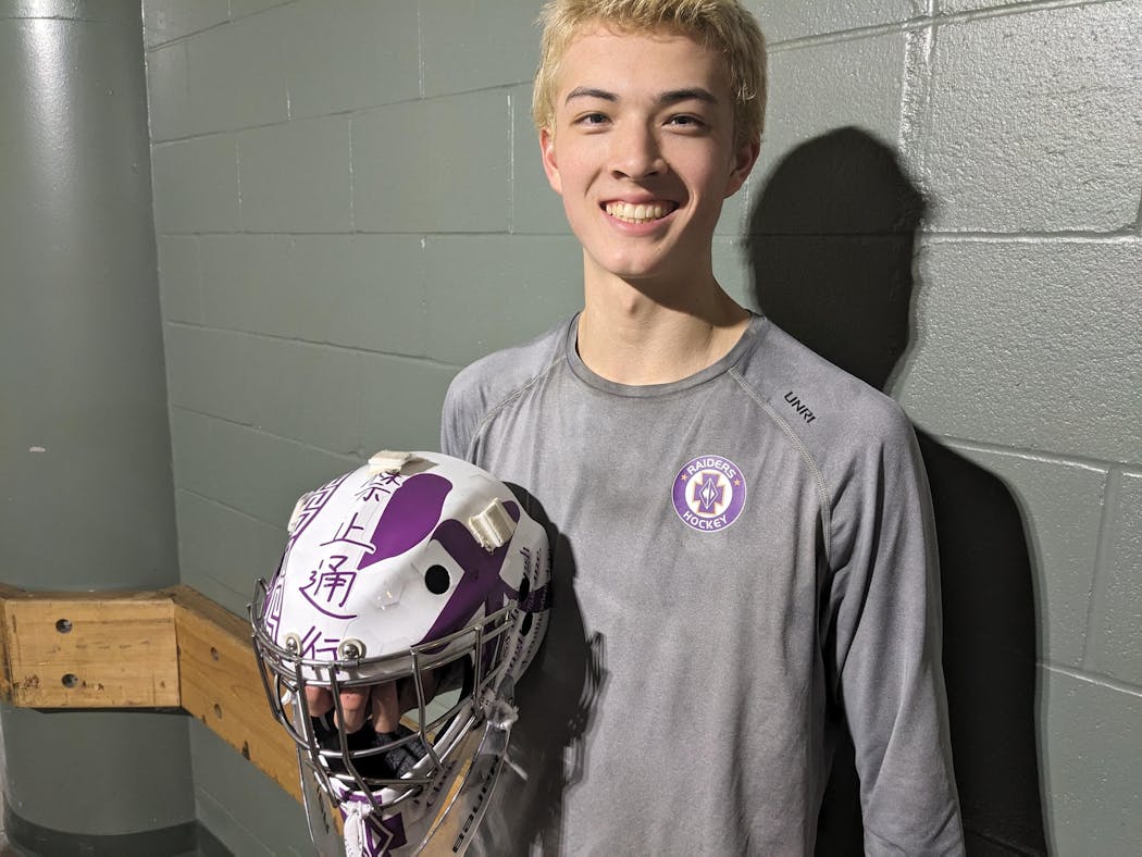 Owen Nelson's goalie mask features messages and symbols to honor is Vietnamese grandparents and a teammate who passed away in 2022.