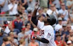 Minnesota Twins Miguel Sano pointed to the sky in the first inning after his 2-run homer.