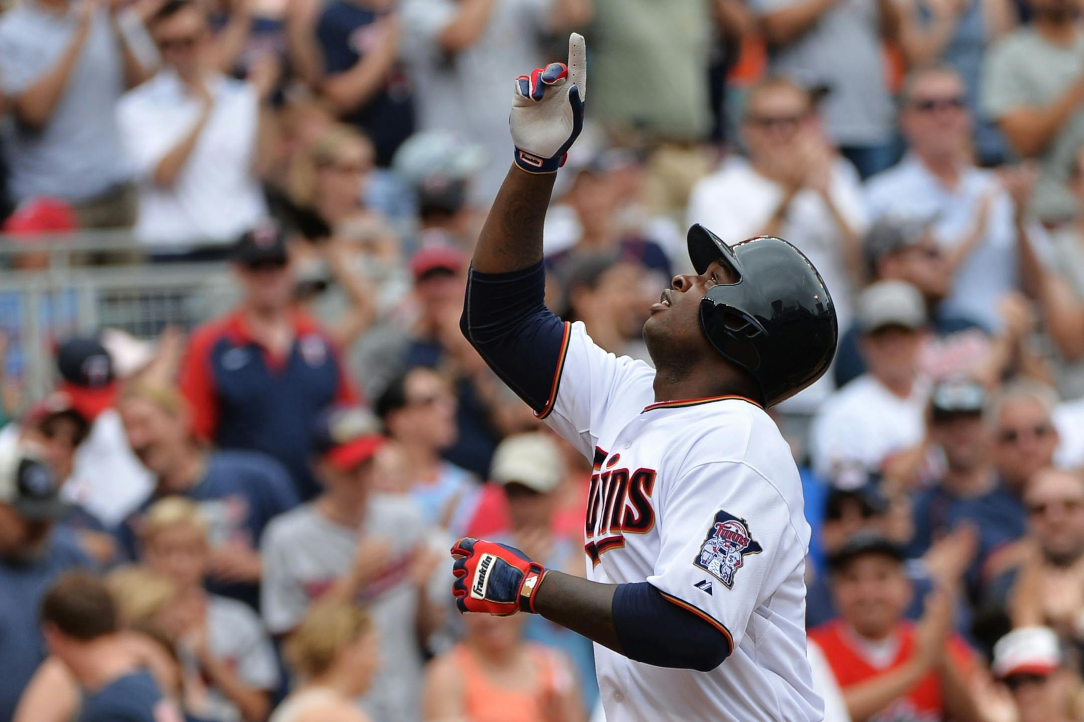 Minnesota Twins Miguel Sano pointed to the sky in the first inning after his 2-run homer.