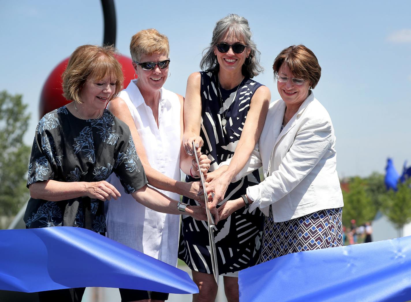 The re-opening day at the Minneapolis Sculpture Garden Saturday, June 10, 2017, in Minneapolis, MN. Here, Lt. Gov. Tina Smith, left to right, Minneapolis Parks superintendent Jayne Miller, Walker Art Center's executive director Olga Viso and U.S. Sen. Amy Klobuchar, cut the ribbon officially re-opening the Minneapolis Sculpture Garden.] DAVID JOLES &#xef; david.joles@startribune.com re-opening day at the Minneapolis Sculpture Garden