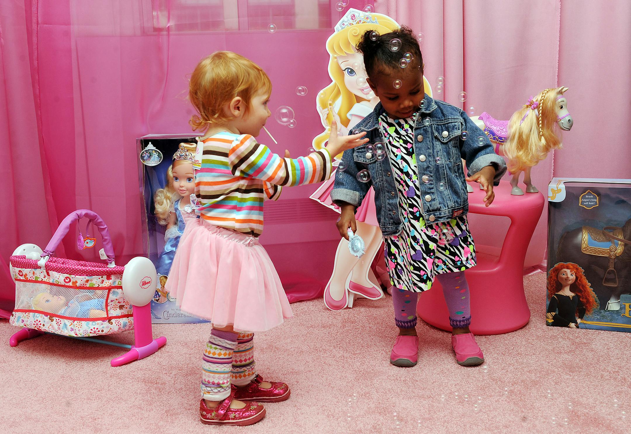 Guests play with the Tollytots preschool toys collection at the Tollytots/JAKKS Pacific "Playdate in the City" event benefitting Operation Smile, on Saturday, Sept. 29, 2012 in New York. (Photo by Scott Gries/Invision for Tollytots/AP Images) ORG XMIT: INVL