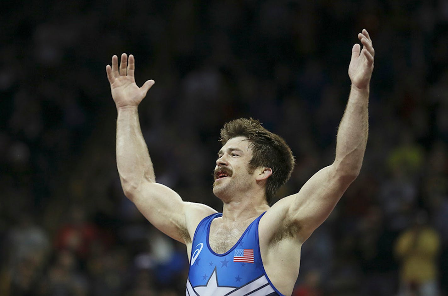 Minnesota Storm's Andy Bisek celebrates his victory over Geordan Speiller in 75kg Greco Roman wrestling for a spot on the Olympic team. He begins his Olympics on Sunday.