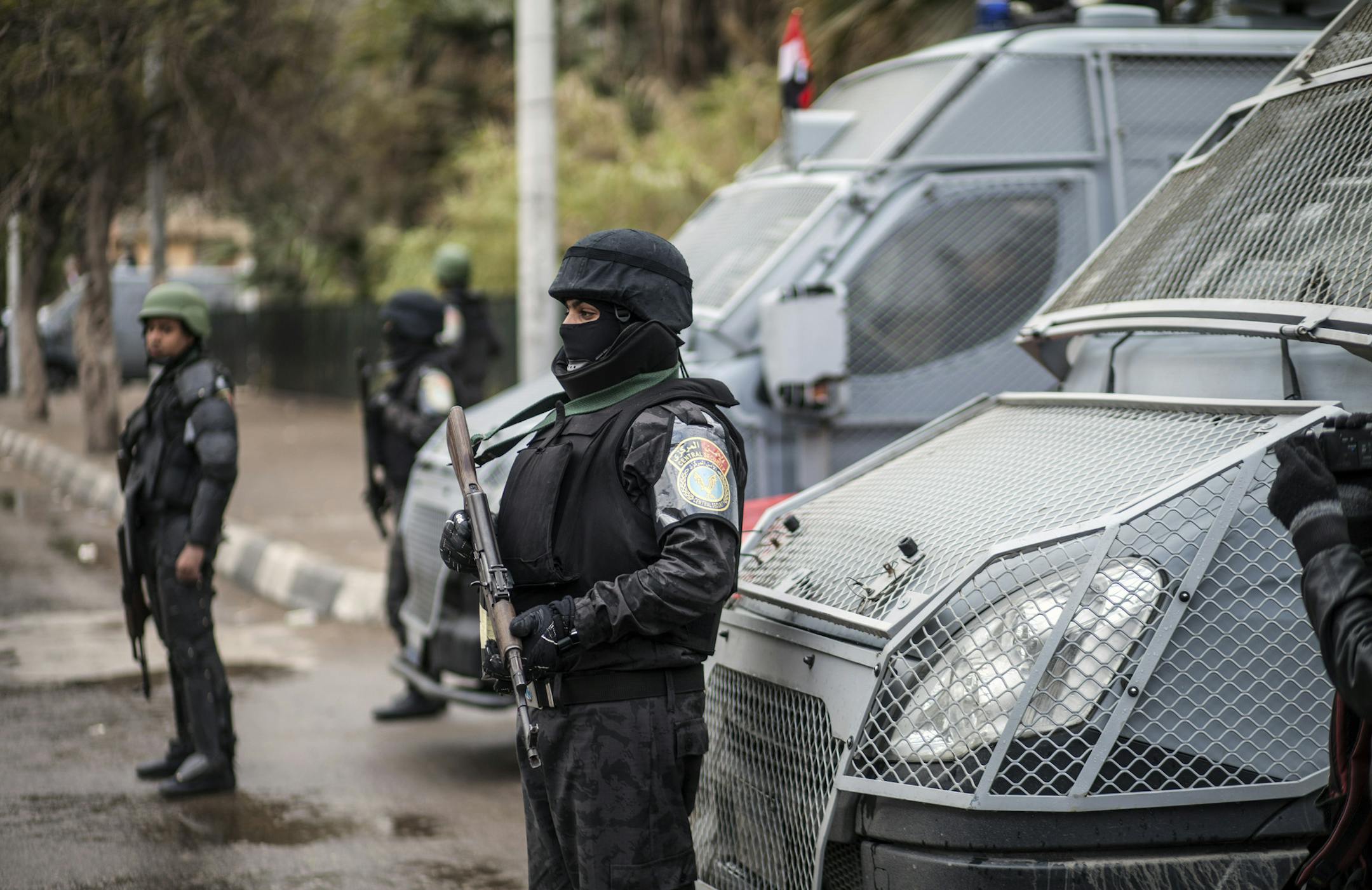 Policemen stand guard as they patrol a street on Police Day, which is also the anniversary of the 2011 uprising, in Tahrir Square, in the Haram district of Cairo, Egypt, Monday, Jan. 25, 2016. The uprising failed to bring about the goals of democracy and freedom the pro-democracy youths who spearheaded the 'revolution' had espoused. The run-up to the anniversary has seen stepped-up security measures as well as a new wave of arrests and security checks in downtown. (AP Photo)