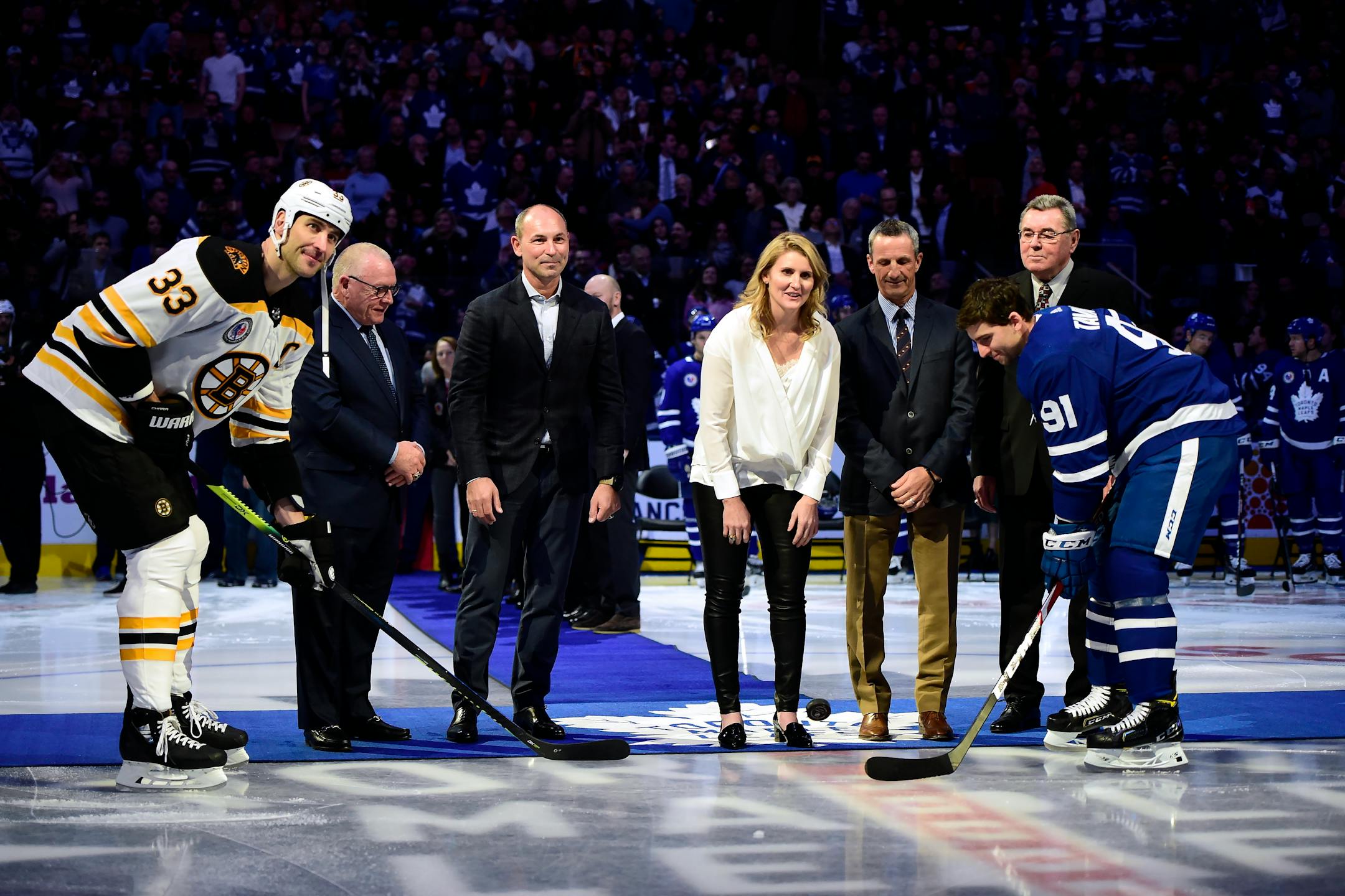 Members of the Hockey Hall of Fame's inductee class of 2019 (back row left to right) Jim Rutherford, Sergei Zubov, Hayley Wickenheiser, Guy Carbonneau and Vaclav Nedomansky took part in a ceremonial faceoff with Bruins captain Zdeno Chara (33) and Maple Leafs captain John Tavares (91) before a Nov. 15 game in Toronto.