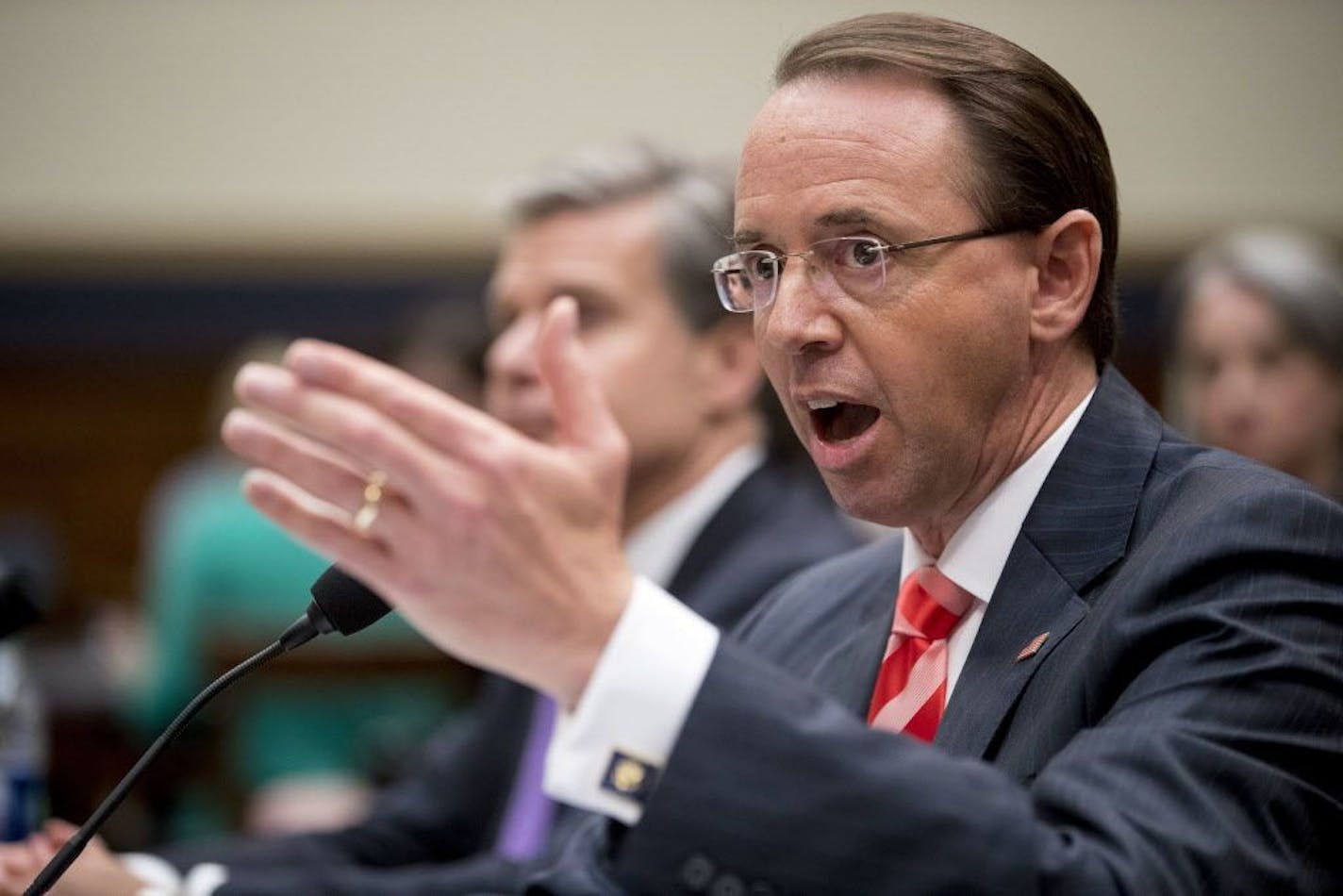 Deputy Attorney General Rod Rosenstein, right, accompanied by FBI Director Christopher Wray, left, testifies before a House Judiciary Committee hearing on Capitol Hill in Washington, Thursday, June 28, 2018, on Justice Department and FBI actions around the 2016 presidential election.