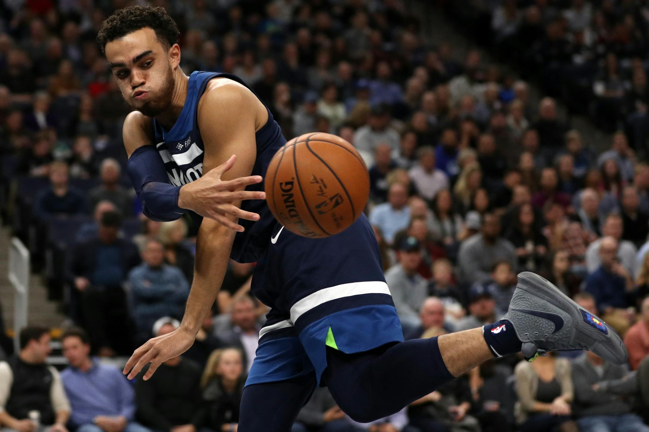 Minnesota Timberwolves guard Tyus Jones (1) threw the ball back in play as he fell out of bounds in the first half.