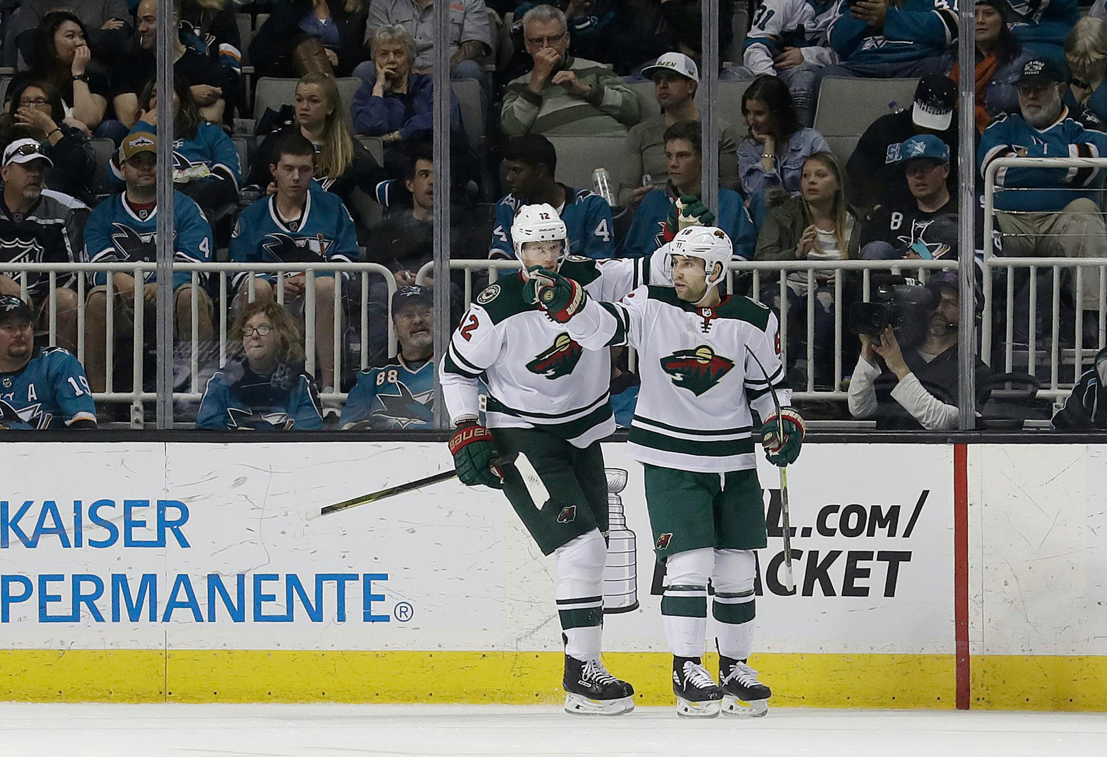 Wild left wing Jason Zucker, right, celebrates with Eric Staal after scoring a goal against the San Jose Sharks during the second period of Saturday's game.