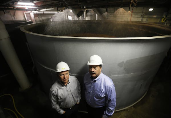 William T. Rahr left President and Gary V. Lee president and chief executive officer posed in front of a the steeping process of barley. Profile of Sh