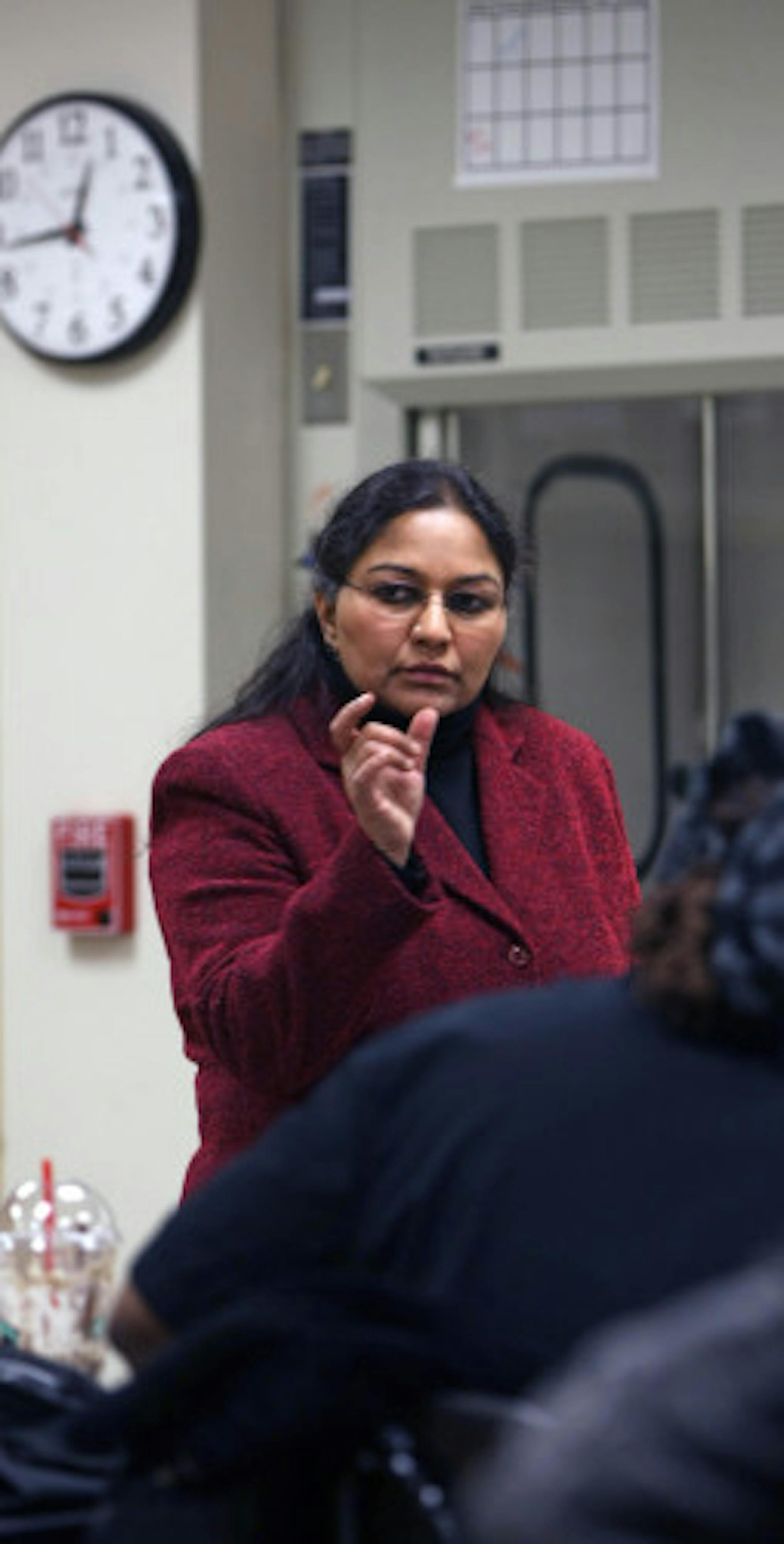 North Hennepin Community College Professor of Chemistry Eugenia Paulus helped her students review material for an upcoming test in her chemistry class.