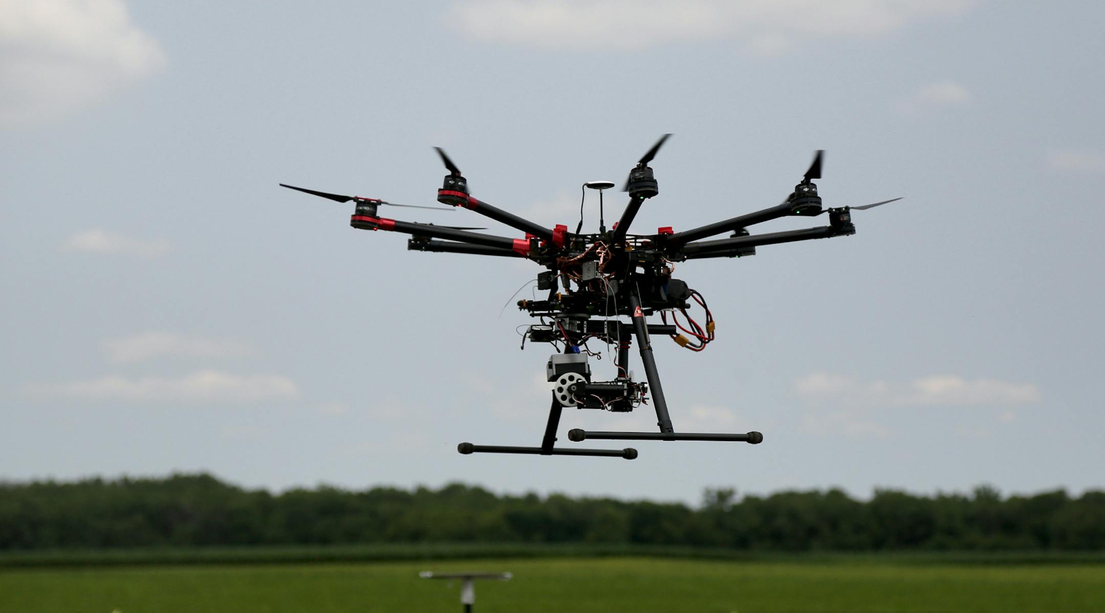 This DJIS-1000 hovered as to landed after a test flight. ] (KYNDELL HARKNESS/STAR TRIBUNE) kyndell.harkness@startribune.com University of Minnesota researchers are testing how well drones, or unmanned aircraft systems, detect insects like soybean aphids and potato beetles. in Rosemount, Min., Thursday, July 7, 2015. ORG XMIT: MIN1507071424400151