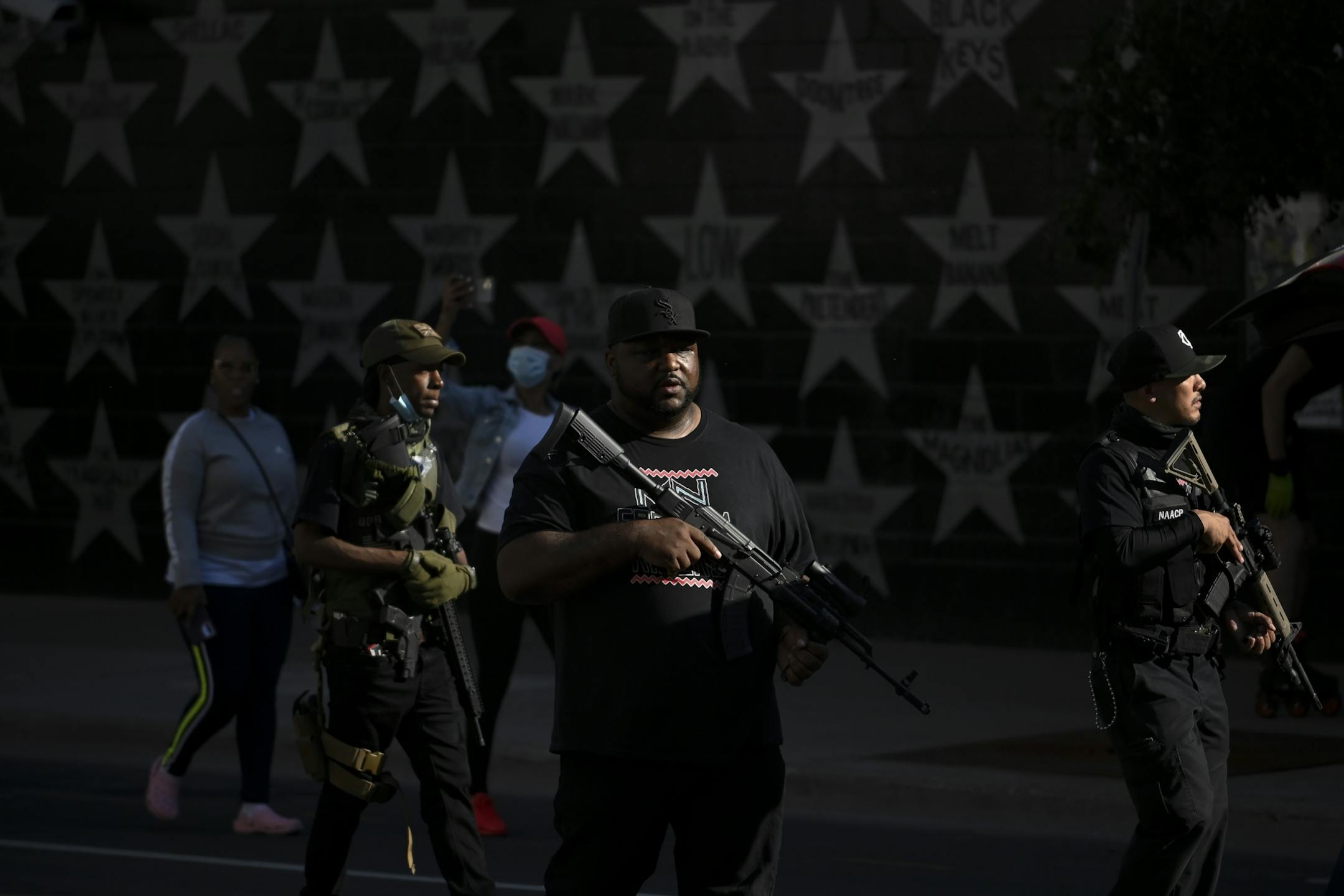 Armed members of the Minnesota Freedom Riders walked past First Avenue during Saturday's march.