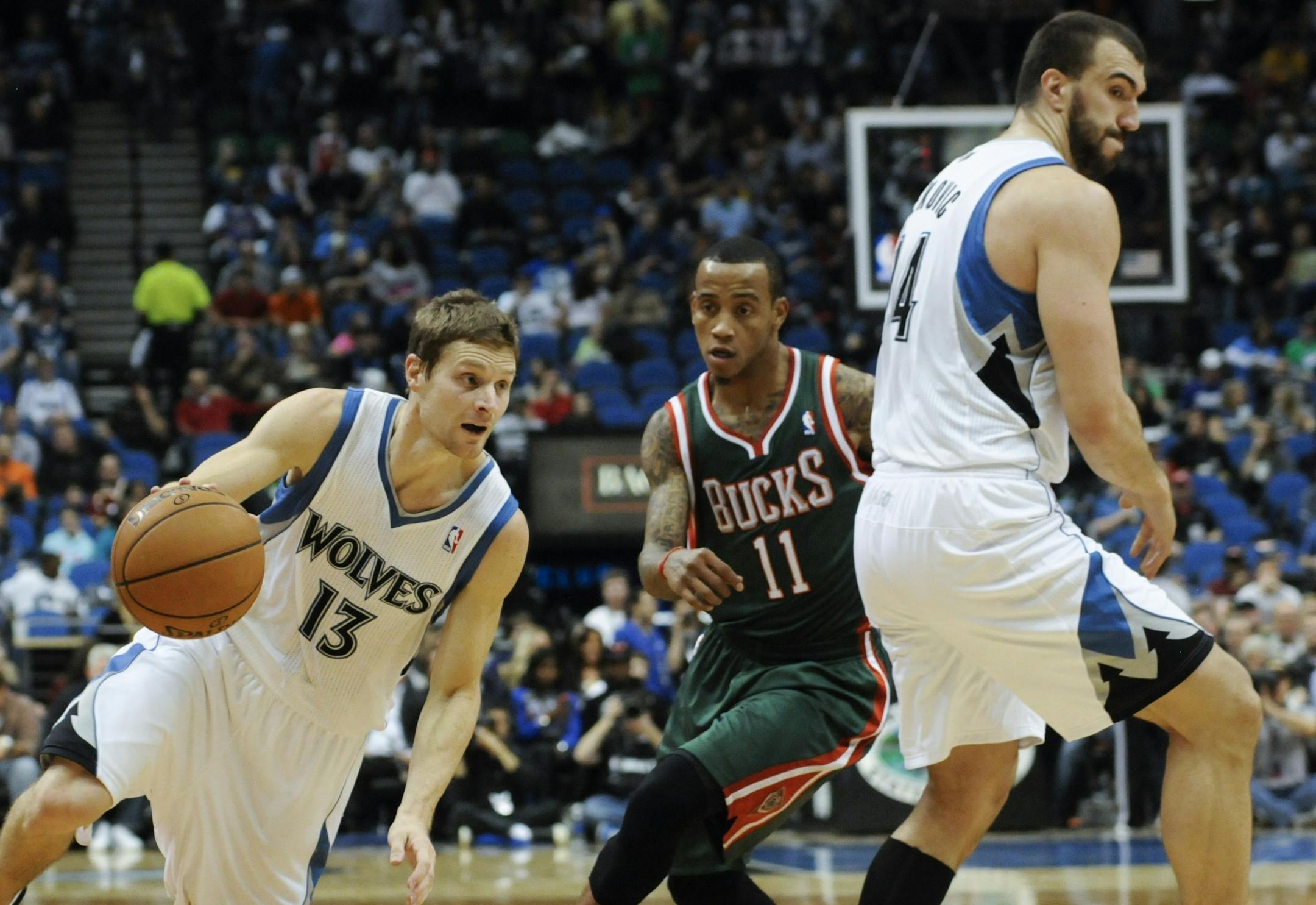Nikola Pekovic, right, of Montenegro, sets a pick against the Bucks' Monta Ellis as Luke Ridnour drives.