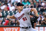 Minnesota Twins starting pitcher Tyler Mahle throws to a Chicago White Sox batter during the first inning of a baseball game in Chicago, Saturday, Sep