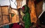 Faduma Adan Abdirahman, 33, held tight a newborn son on Nov. 4, 2022, hours after the death of her 3-year-old daughter, Hawa, at a relief camp outside