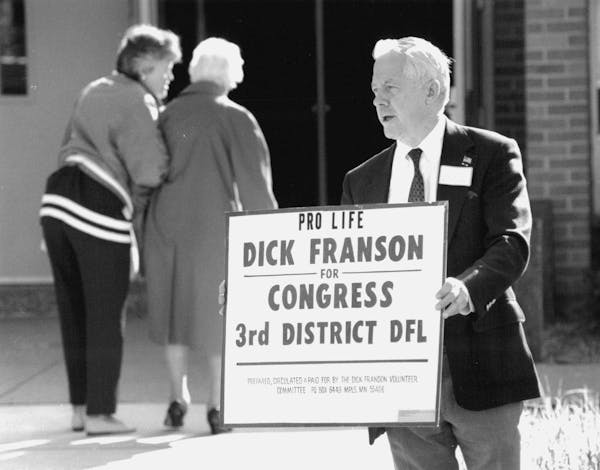 September 6, 1992 "Dick Franson, running for congress in the 3rd district on a pro-life platform, greeted people entering the Assumption Catholic Chur