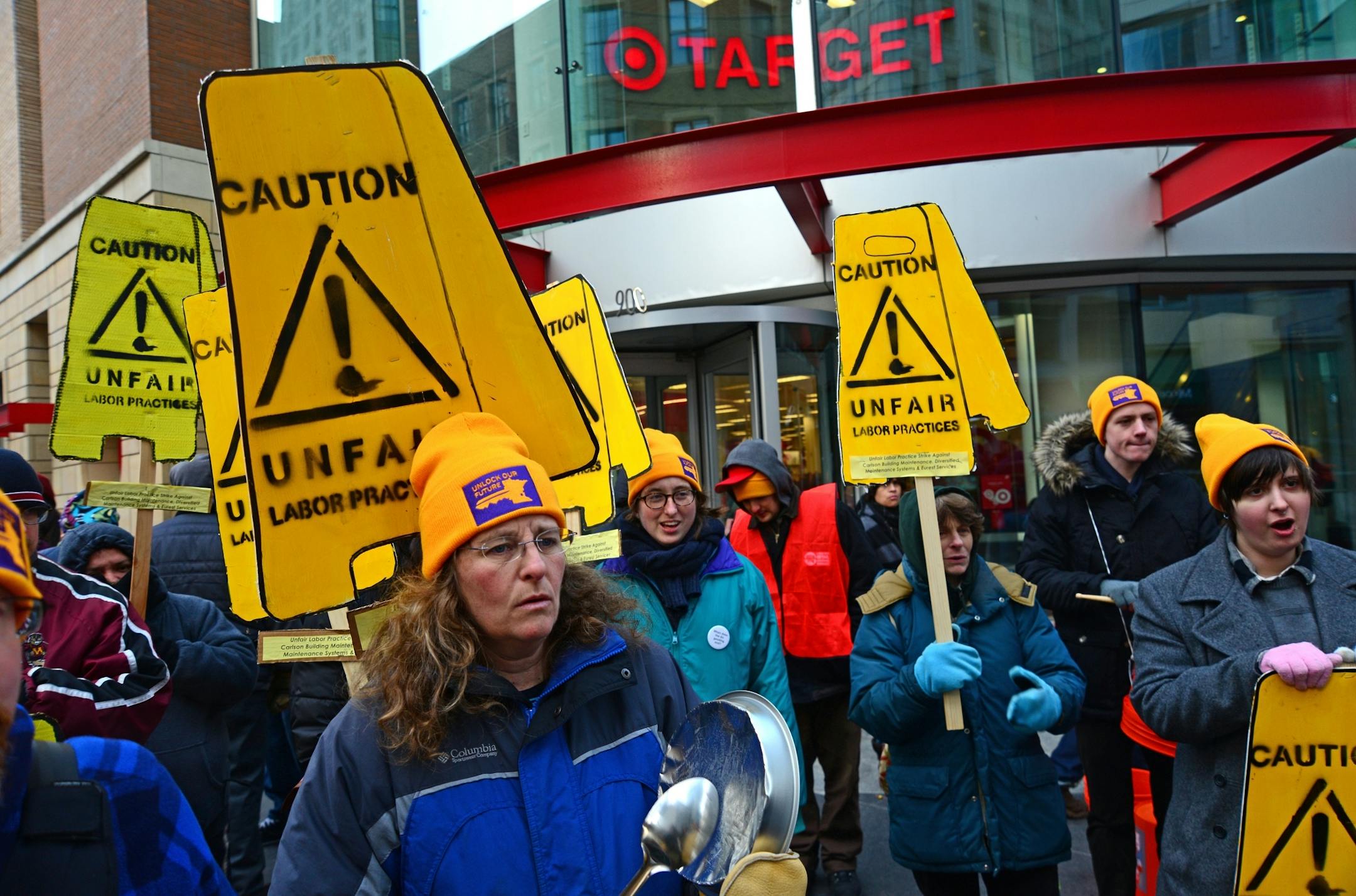 This morning Tuesday February 26, 2013 non union janitors picketed in front of the downtown Target store. About 50 people carried signs and shouted slogans while marching around the front entrance to the store.