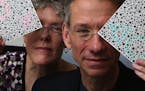 University of Washington researchers Jay and Maureen Neitz, seen holding testing cards for color perception, have teamed up with a California biotech 