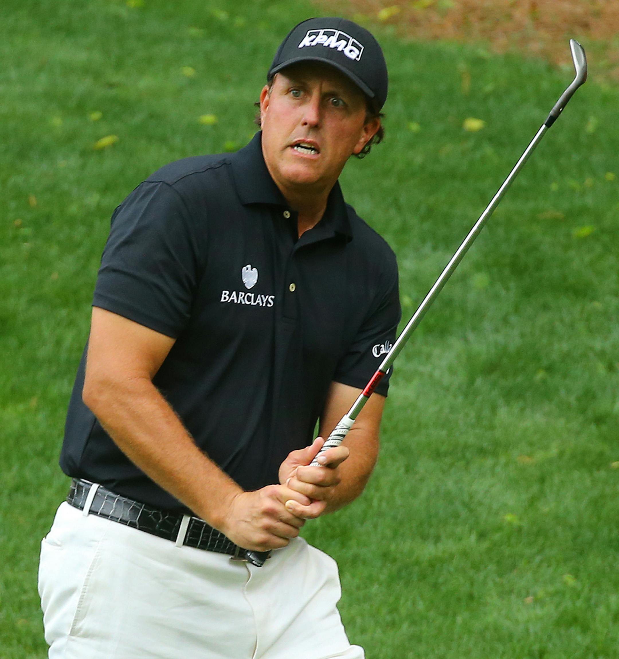 Phil Mickelson reacts as he almost chips in from off the edge with an eagle attempt on the 13th hole during the second round of the Masters at Augusta National Golf Club on Friday, April 10, 2015, in Augusta, Ga. (Curtis Compton/Atlanta Journal-Constitution/TNS)