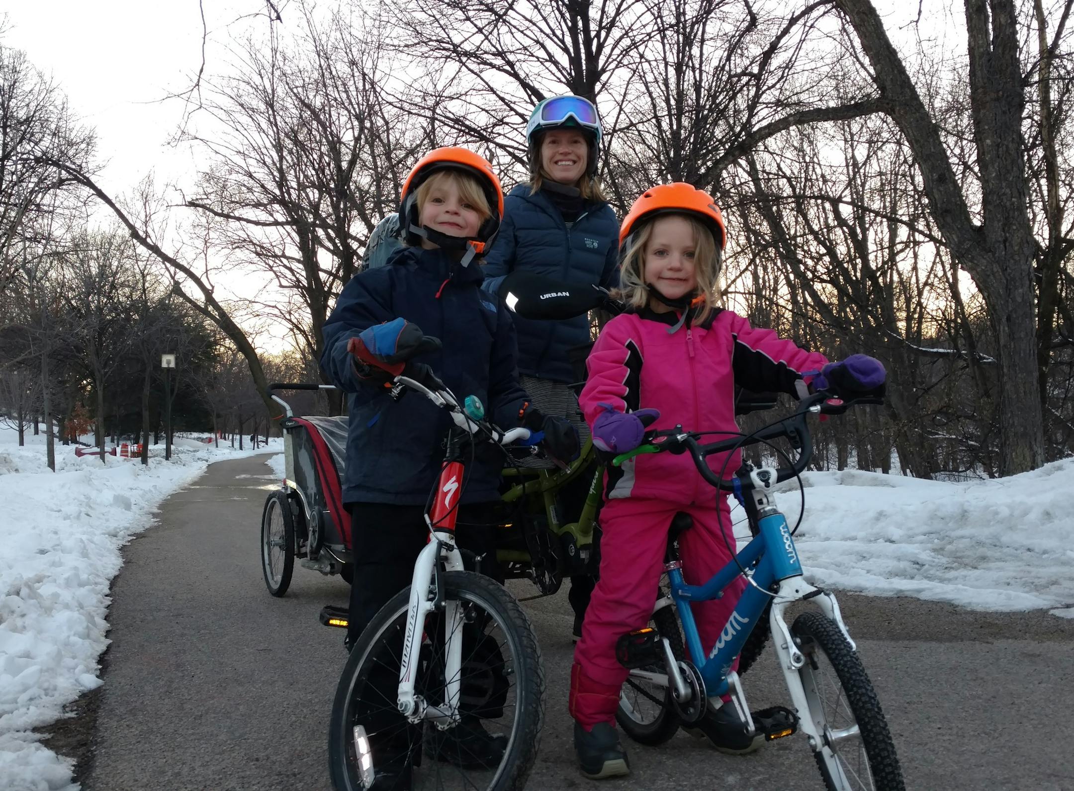 Stephanie Brodegard and two of her kids, Grant and Darcy, during a recent bike ride. The Brodegard family, which also includes husband Bill and youngest child Lewis, spent a year without a car in Minneapolis, getting around mainly by bike.
