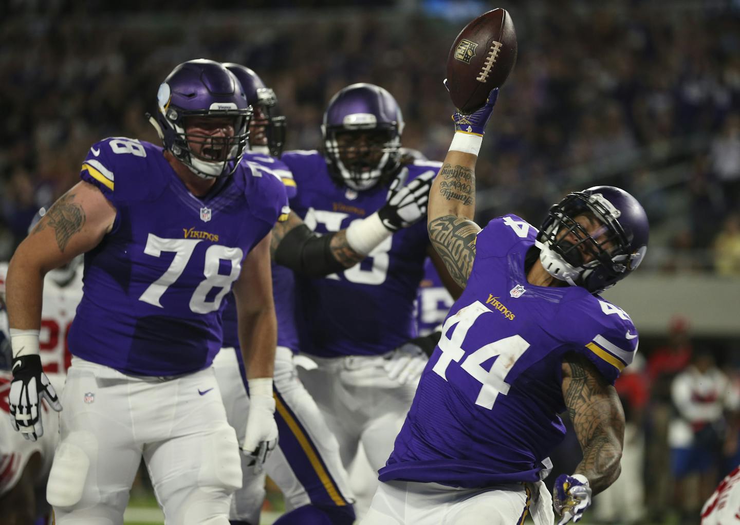 With Jeremiah Sirles (78) helping clear the way, Vikings running back Matt Asiata (44) burst through for a 1-yard score in the first quarter against the Giants earlier this month.