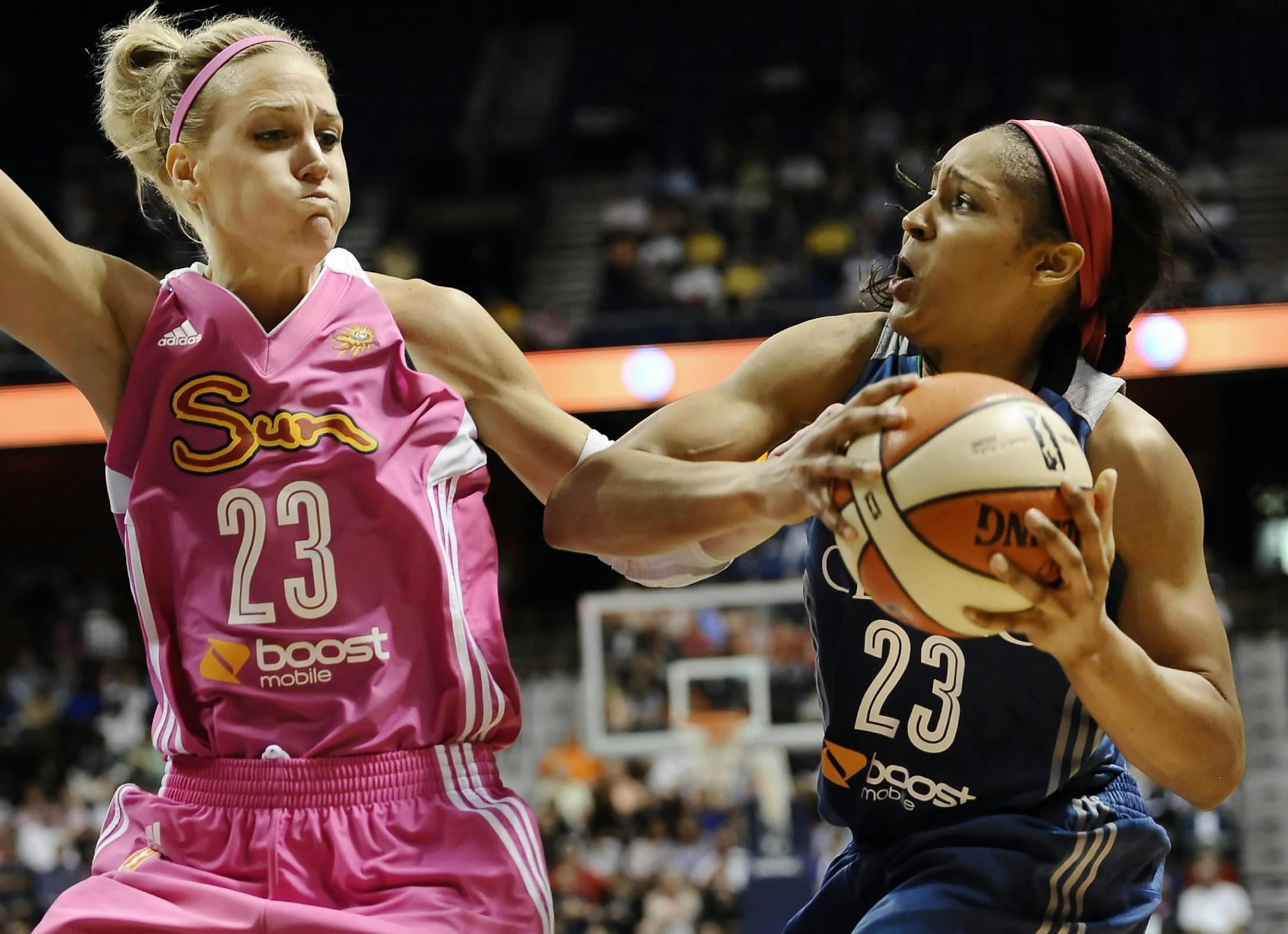 Lynx forward Maya Moore, right