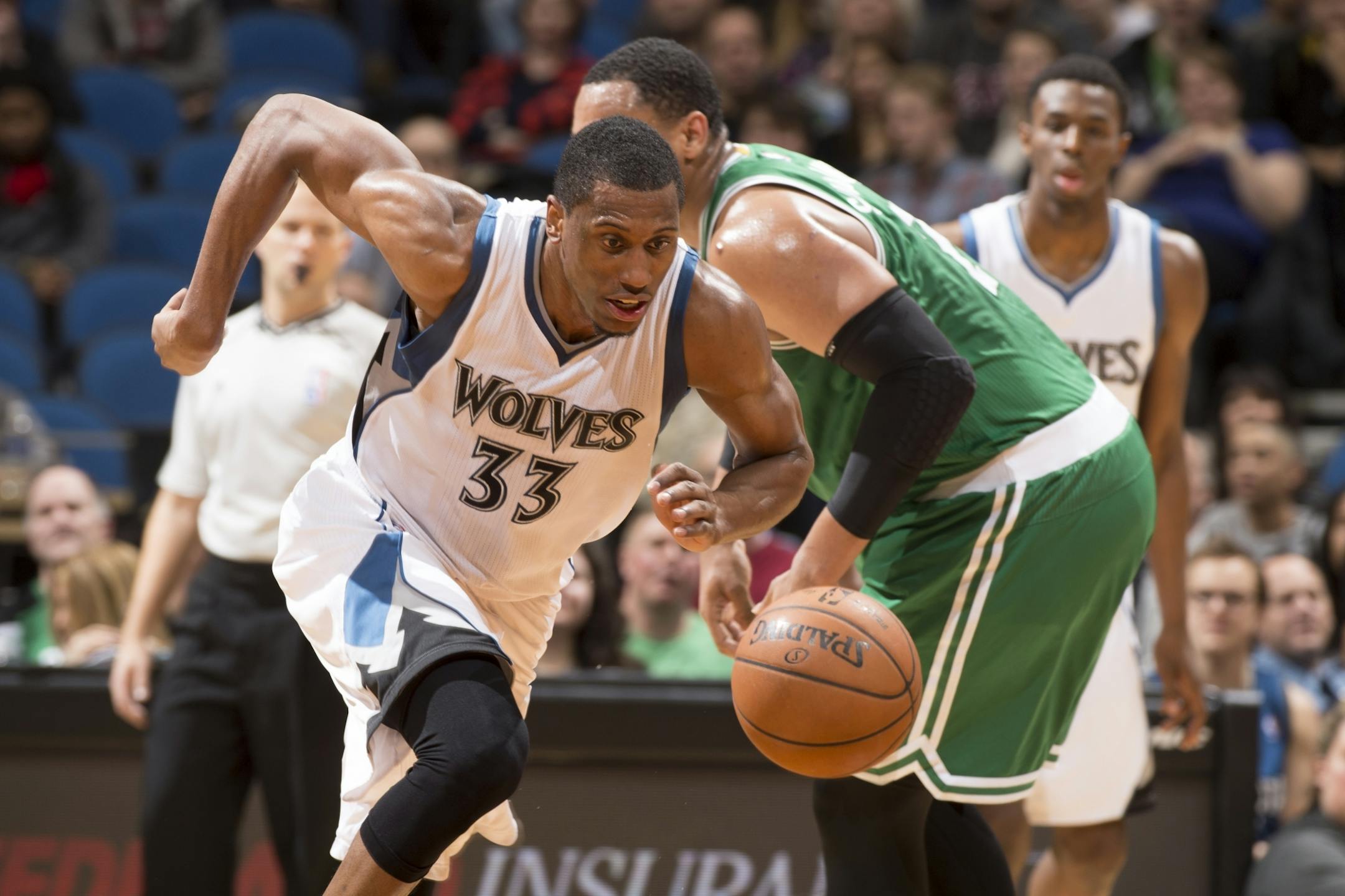 Minnesota Timberwolves forward Thaddeus Young (33) chases down ball he knocked loose from Boston Celtics forward Jared Sullinger (7) during the third quarter.