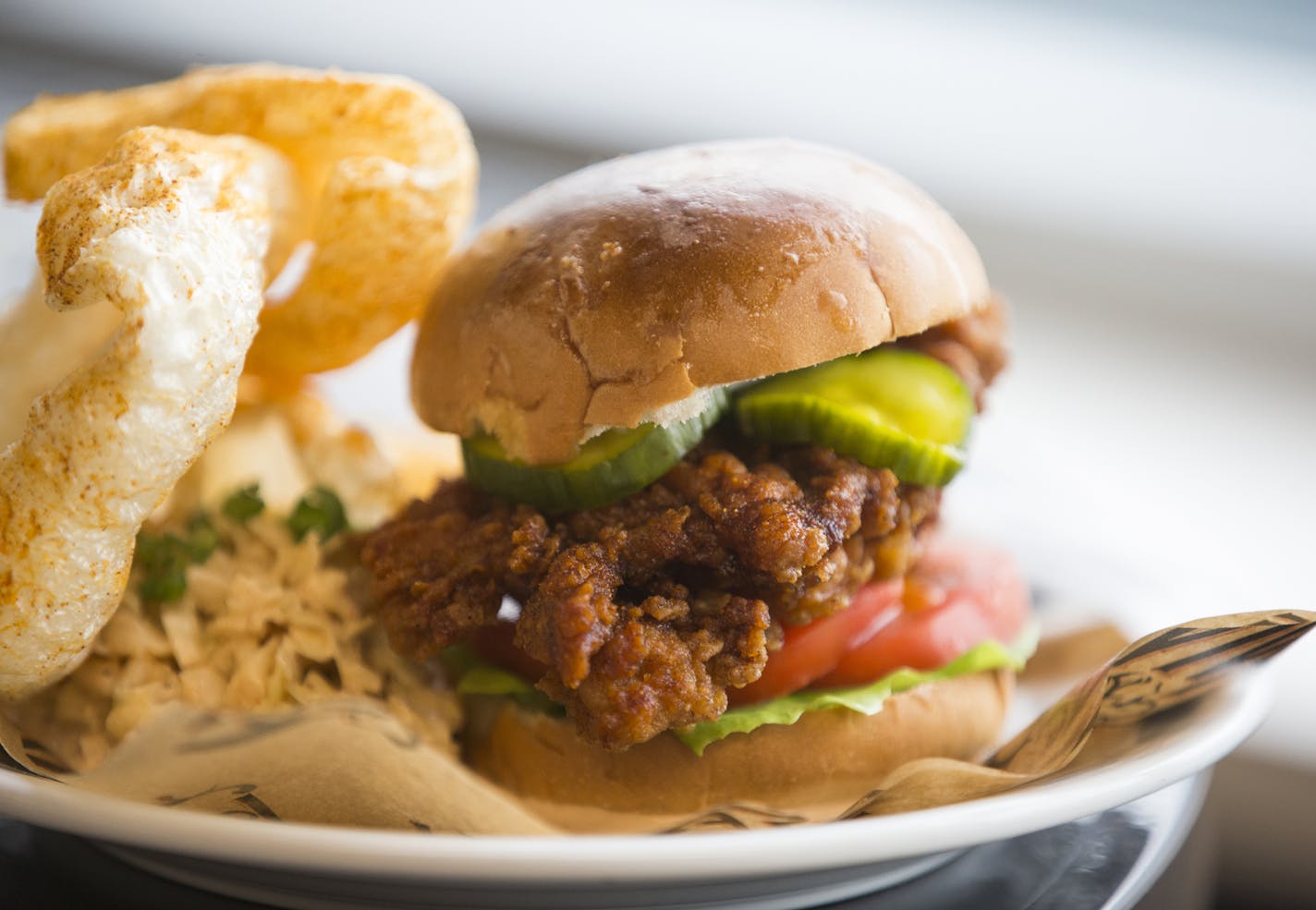 The fried chicken sandwich from Revival, one of their menu items that will be available at U.S. Bank Stadium. ] (Leila Navidi/Star Tribune) leila.navidi@startribune.com BACKGROUND INFORMATION: Officials with the Minnesota Vikings, the Minnesota Sports Facilities Authority and Aramark announce some of the local culinary partners that will be featured at U.S. Bank Stadium during a press conference on Tuesday, May 24, 2016.