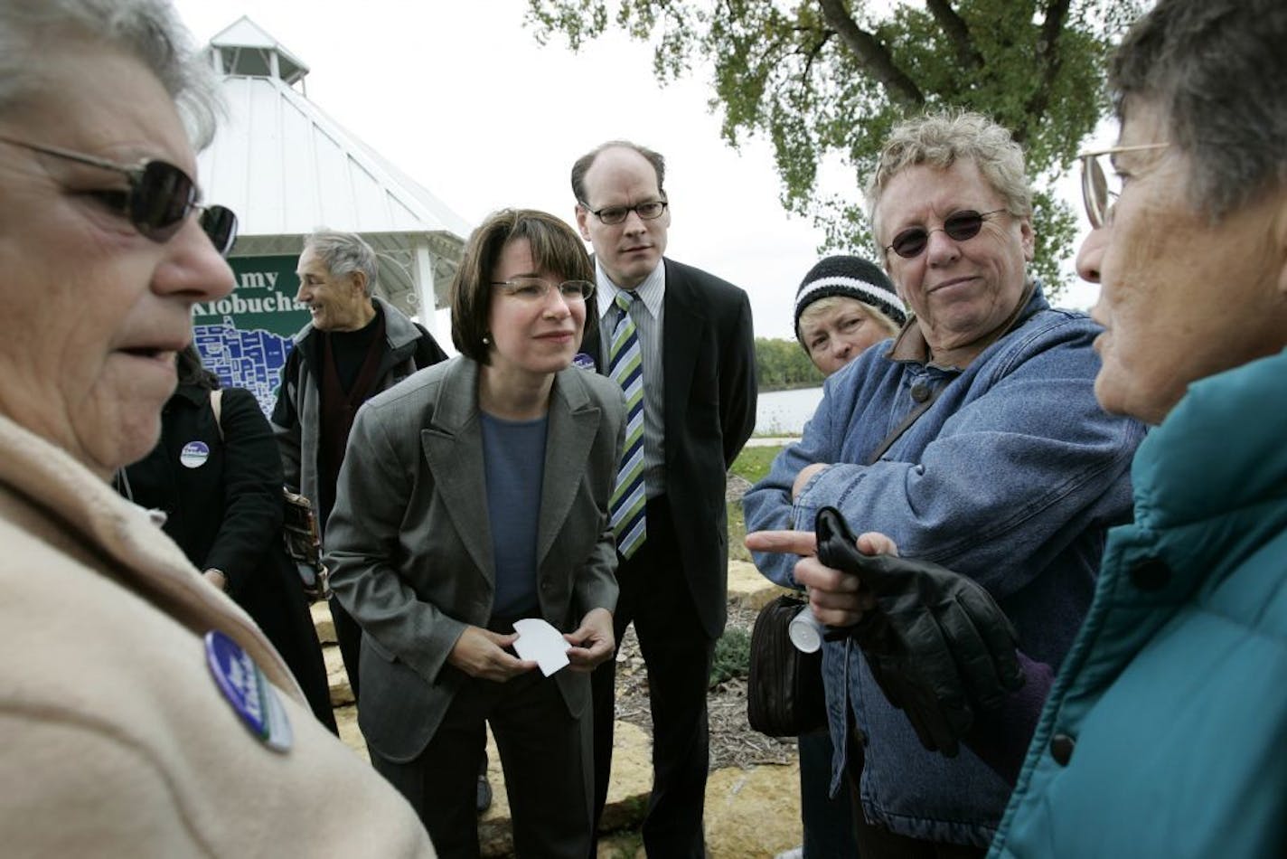 ELIZABETH FLORES ï eflores@startribune.com Wabasha, MN - September 29, 2006 - County Attorney Amy Klobuchar, a U.S. Senate candidate, gets support from her husband John Bessler, right, as she speaks to supporters at her last stop of her tour of all of Minnesotaís counties known as ìNorth Star Tour. ì To date, Klobuchar has visited 87 counties. Klobuchar vows to visit every county every year that she is in office.