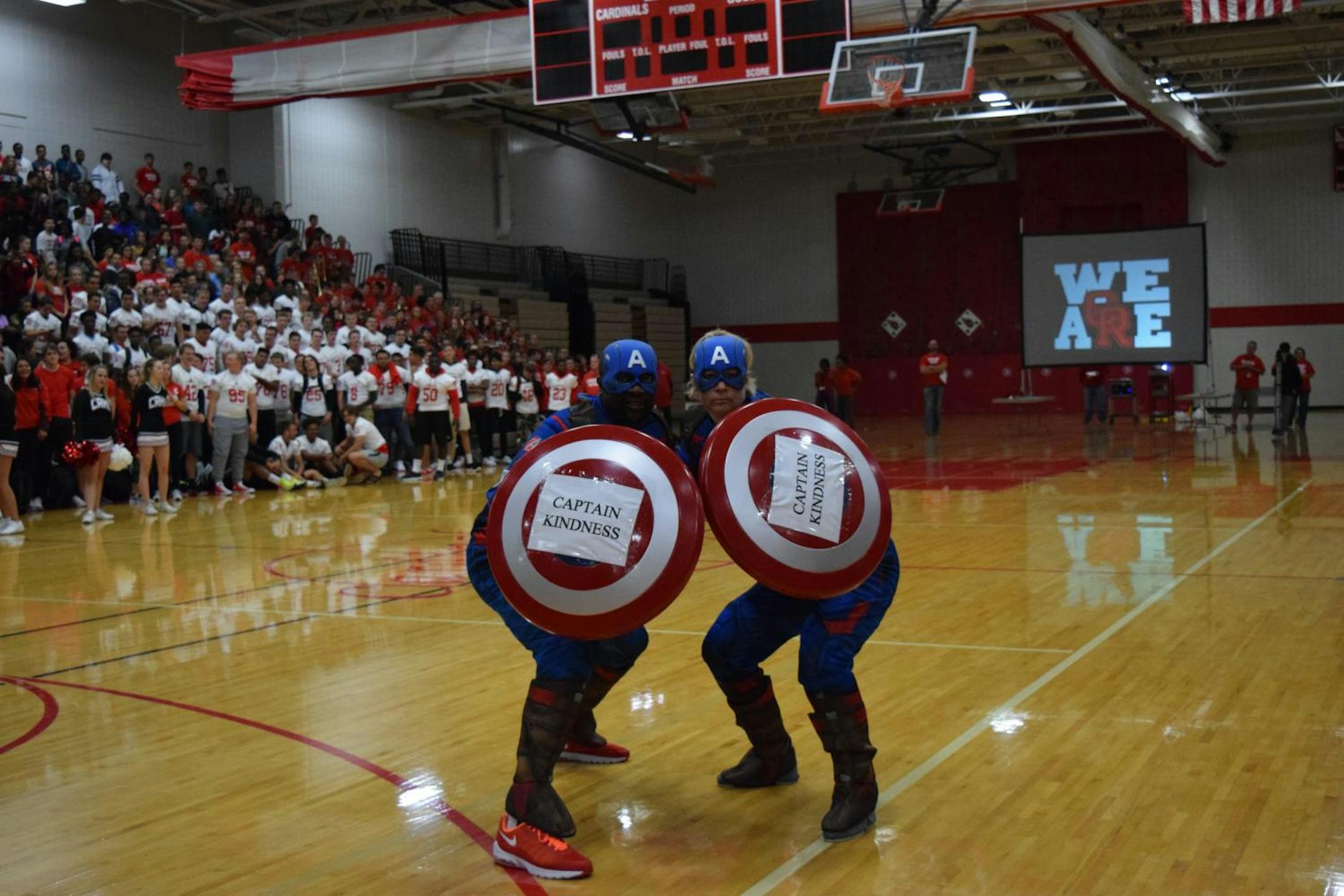 Coon Rapids High School assistant principals DeMann Seals (left) and Shannon Madison dressed up as superheros to launch the school's "Kindness Matters" campaign.
