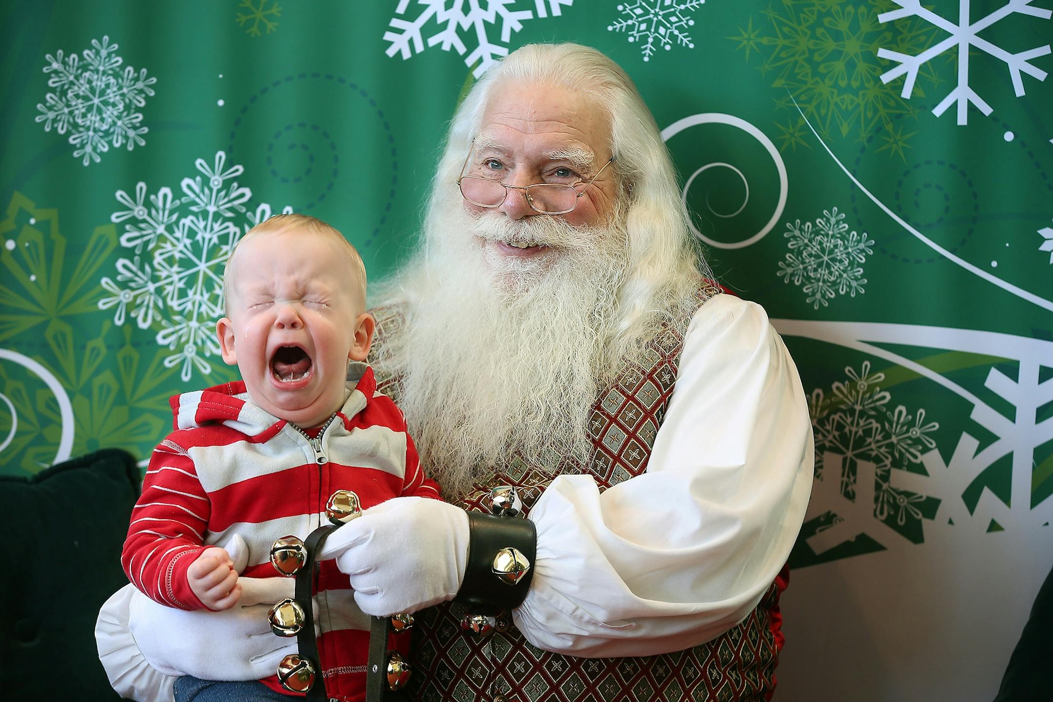 Simon Tichy, 18 months, of St. Louis Park, MN, screamed and cried as he sat with "Santa" for a photo at Southdale Mall, Friday, December 4, 2015 in Edina, MN.
