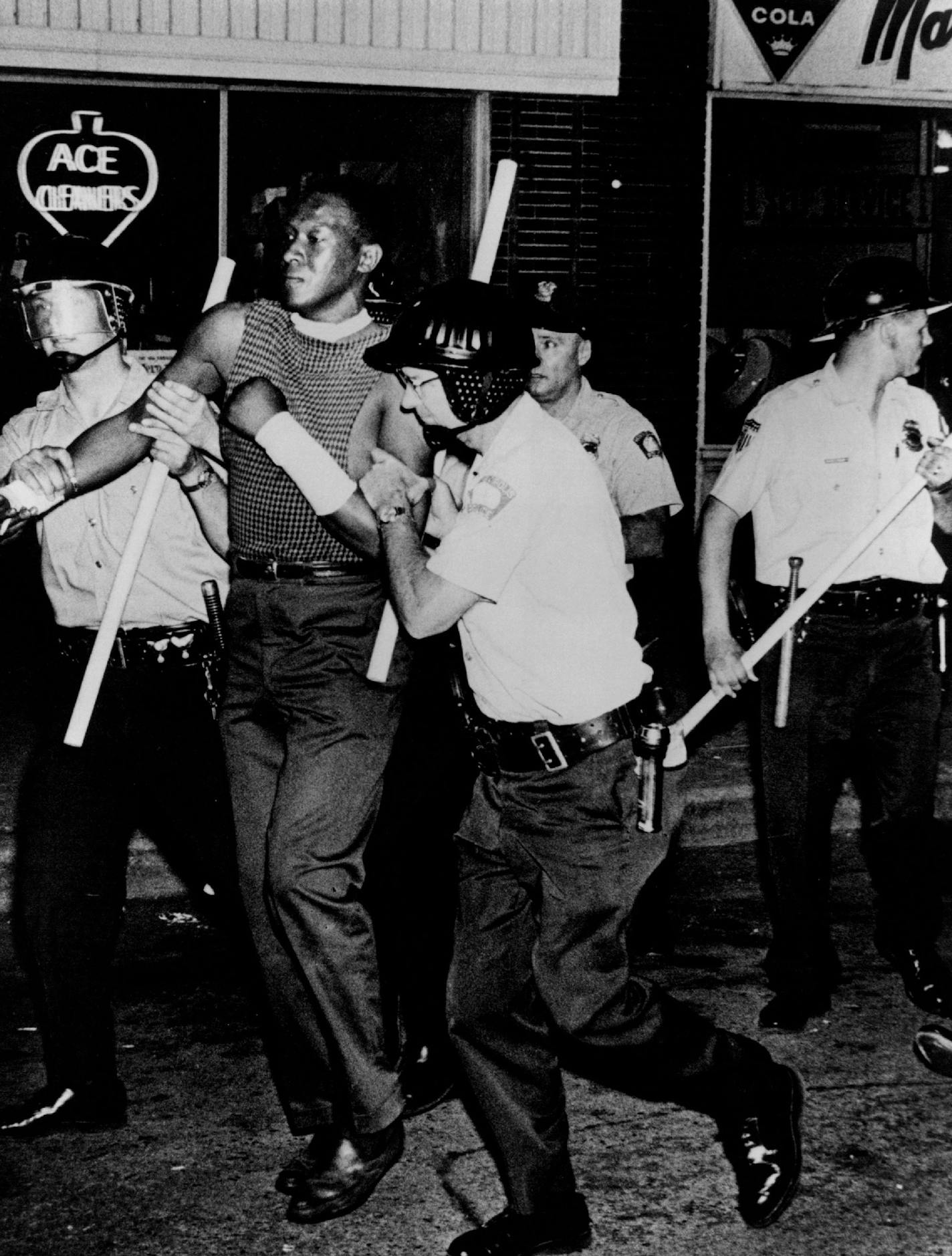 July 20, 1967 Police arrested a demonstrator on Plymouth Av. Picture Magazine; Minneapolis Sunday Tribune ORG XMIT: MIN2015112414420817