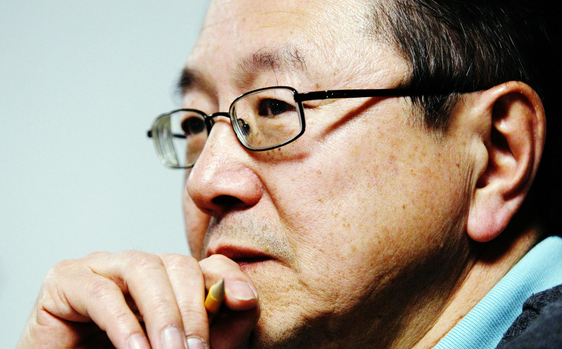 Rick Shiomi, writer and director of the play "Yellow Fever", watches the production's rehearsal at Mu Performing Arts Friday, March 1, 2013 in Minneapolis. The play launched the career of Shiomi and marks his final production as Mu's artistic director. (Genevieve Ross/Special to the Star Tribune)