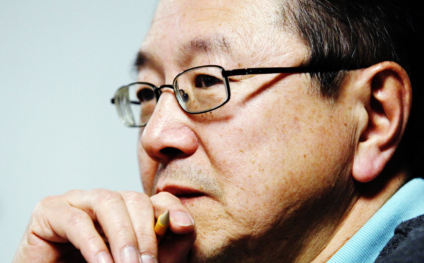Rick Shiomi, writer and director of the play "Yellow Fever", watches the production's rehearsal at Mu Performing Arts Friday, March 1, 2013 in Minneapolis. The play launched the career of Shiomi and marks his final production as Mu's artistic director. (Genevieve Ross/Special to the Star Tribune)