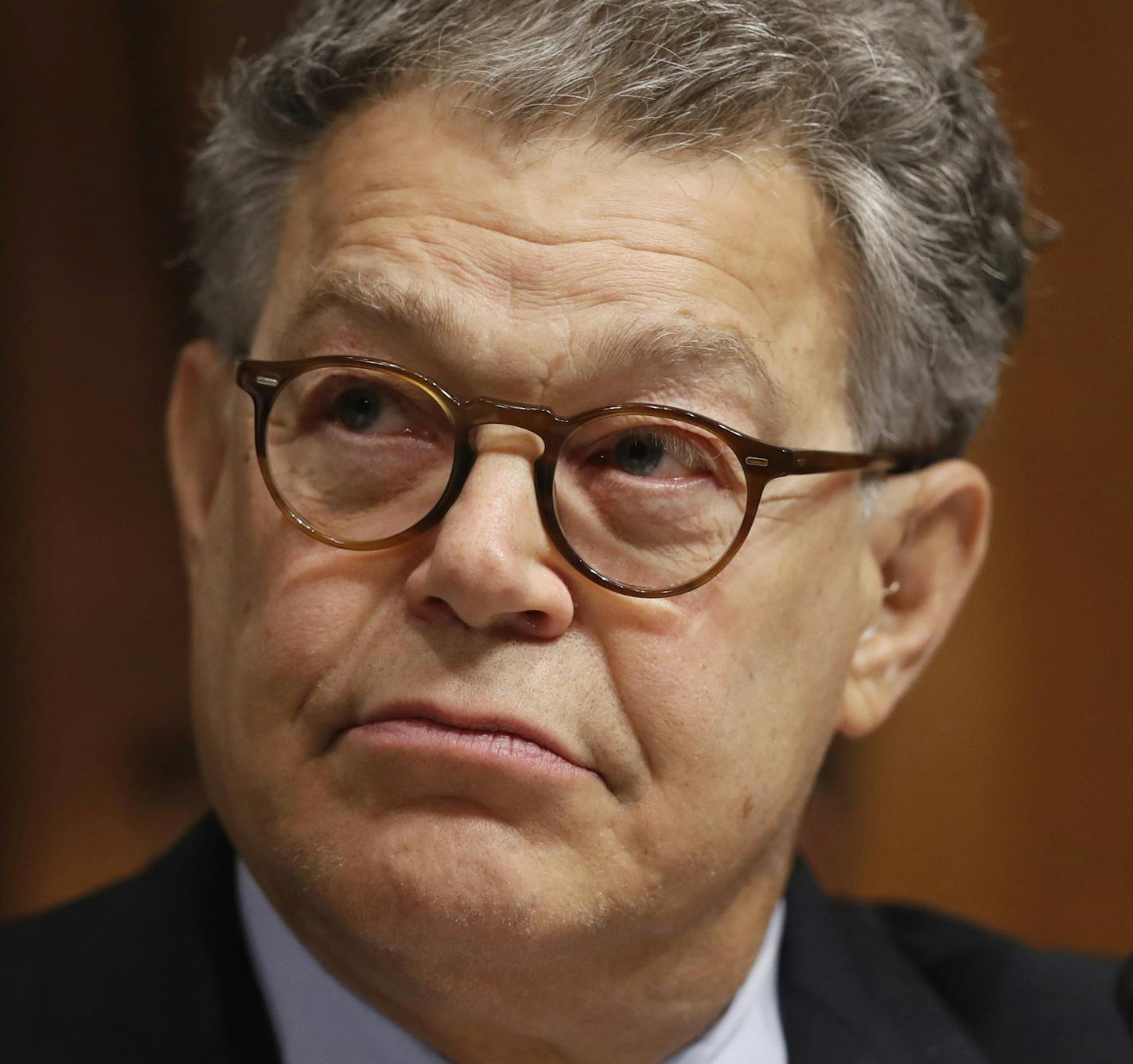 FILE - In this Sept. 20, 2017 file photo, Sen. Al Franken, D-Minn., listens during a Senate Judiciary Committee hearing for Colorado Supreme Court Justice Allison Eid, on her nomination to the U.S. Court of Appeals for the 10th Circuit, on Capitol Hill in Washington. Franken is accused of forcibly kissing a woman while rehearsing for a 2006 USO tour; Franken also was photographed with his hands over her breasts as she slept wearing a flak vest. He has apologized, while maintaining that he rememb