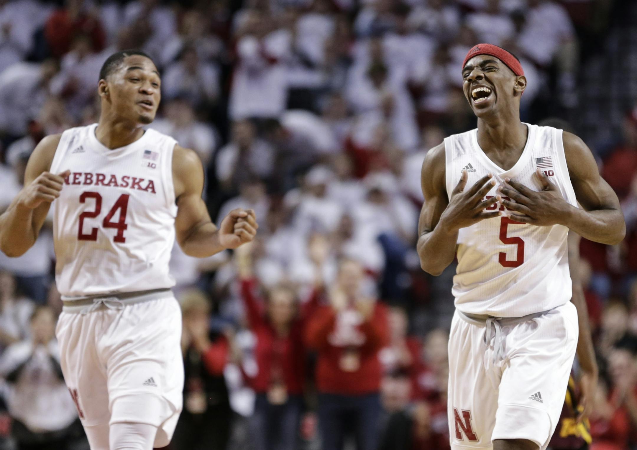 Nebraska's Glynn Watson Jr. (5) laughs with teammate James Palmer Jr. (24), after scoring a basket off a steal during the second half of an NCAA college basketball game against Minnesota in Lincoln, Neb., Tuesday, Dec. 5, 2017. Nebraska won 78-68.