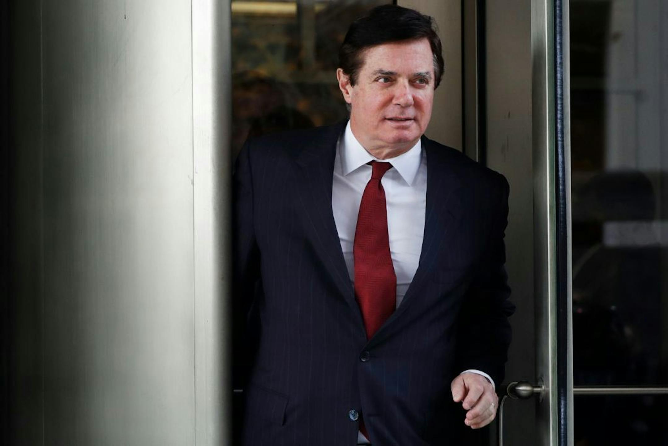 FILE - In this Nov. 6, 2017, file photo, Paul Manafort, President Donald Trump's former campaign chairman, leaves the federal courthouse in Washington. A federal judge's decision to sentence Manafort to less than four years in prison for his conviction on eight felony tax and bank fraud charges, sparked anger and outrage and opened up a conversation about whether the justice system treats different kinds of crimes, and different kinds of criminals, fairly.