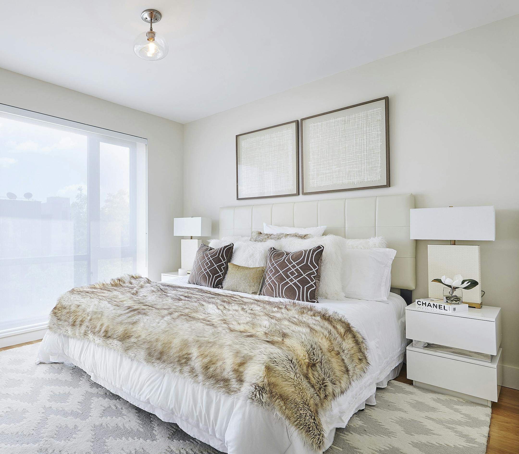Two pieces of framed paper complement this master bedroom. (Design Recipes)