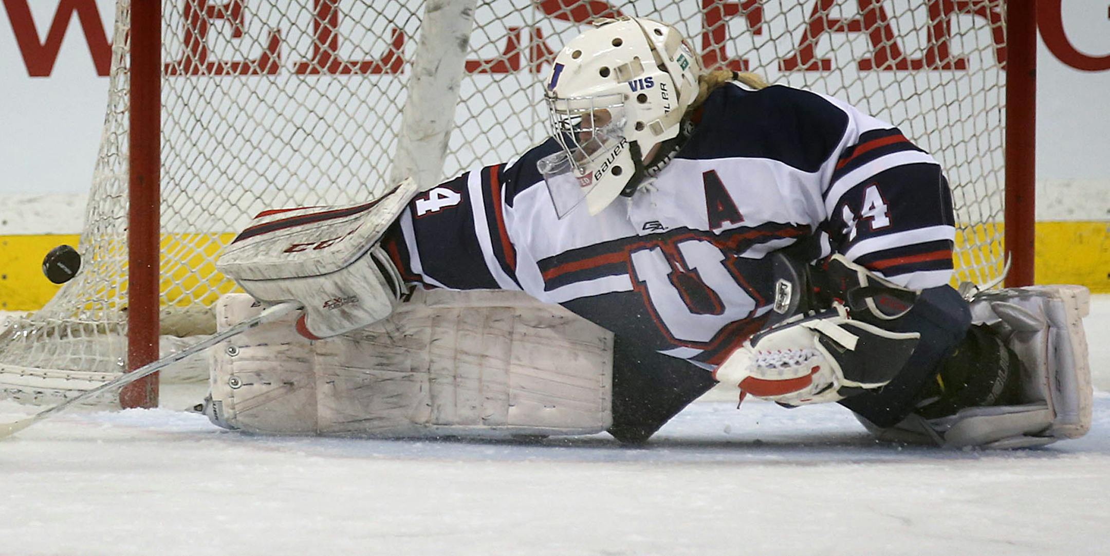 St. Paul United goalie Catherine Johnson made a save on a breakaway in the first period.] JIM GEHRZ ï james.gehrz@startribune.com / St. Paul, MN / February 17, 2016 /1:00 PM ñ BACKGROUND INFORMATION: Alexandria Area High School played St. Paul United in the Class 1A quarterfinals at the Xcel Energy Center at the 2016 Girls' hockey state tournament. St. Paul United won the game, 2-0.