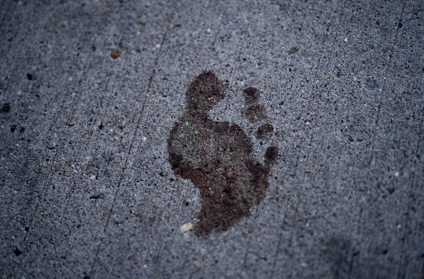 A bare bloody footprint remained on the sidewalk in the 2900 block of Hennepin Avenue for an early morning shooting .] Jerry Holt •Jerry.Holt@startribune.com Gunmen unleashed a torrent of gunfire in a crowded Uptown block early Sunday in Minneapolis, killing one person and wounding 11 others in one of the city's most violent shootings in recent memory. Sunday ,June 21, 2020 in Minneapolis ,MN.