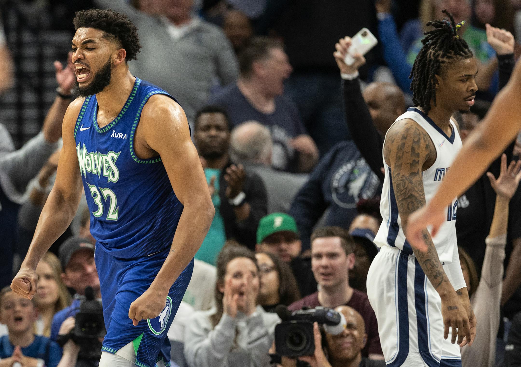 Karl Anthony-Towns (32) of the Minnesota Timberwolves reacts after a dunk in the second quarter.