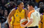 Los Angeles Sparks forward Candace Parker, left, complains about a call to referee Roy Gulbeyan during the second half in Game 4