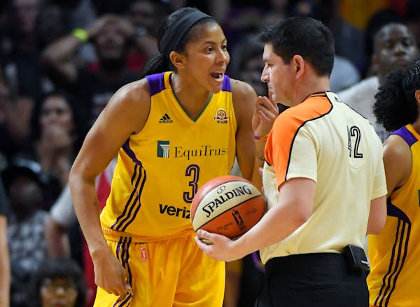 Los Angeles Sparks forward Candace Parker, left, complains about a call to referee Roy Gulbeyan during the second half in Game 4